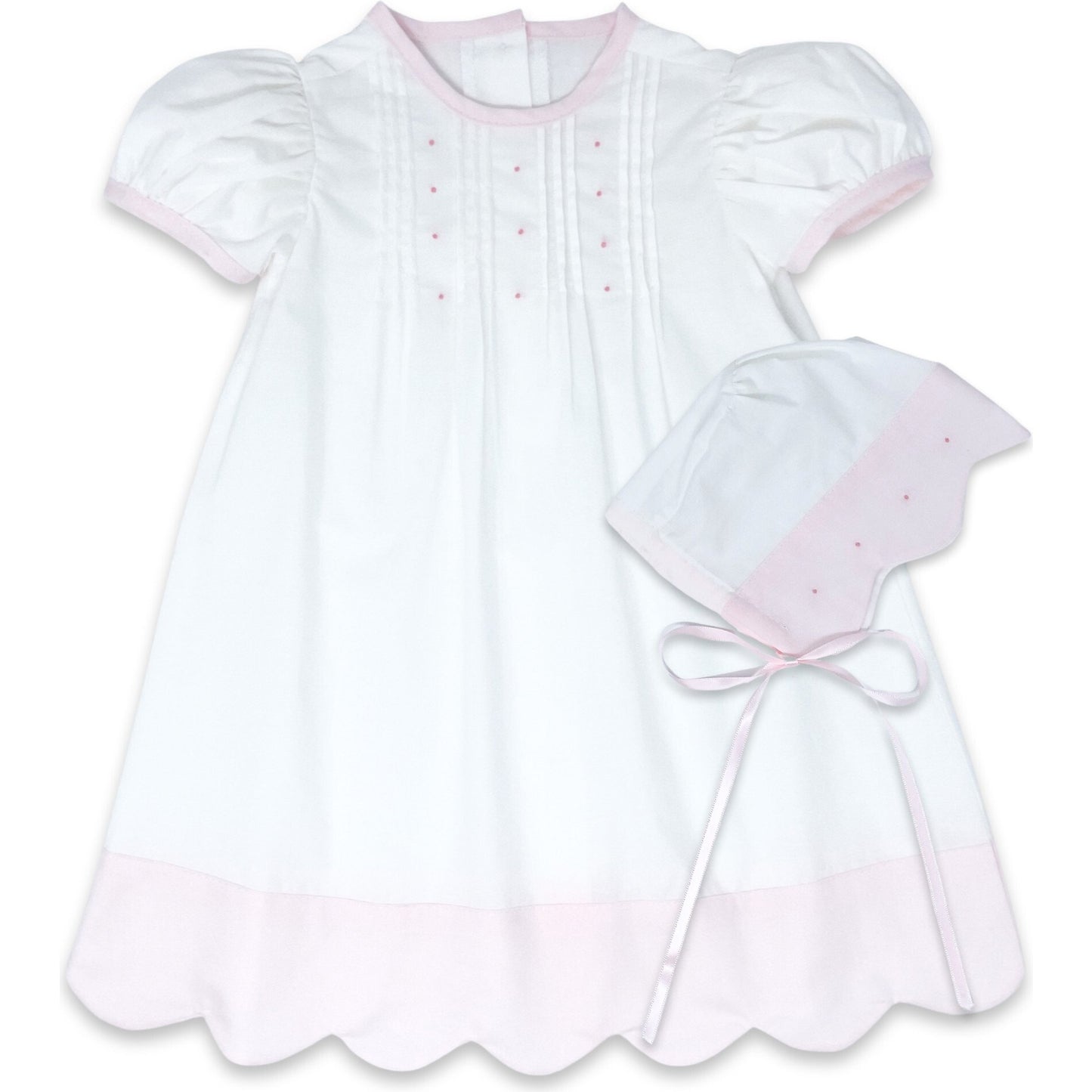 This 1956 Daygown set in white and pink scallop batiste with pink embroidery knots and bonnet is perfect for her most special first occasions and can be passed down with love to future generations.
Material:
100% Cotton