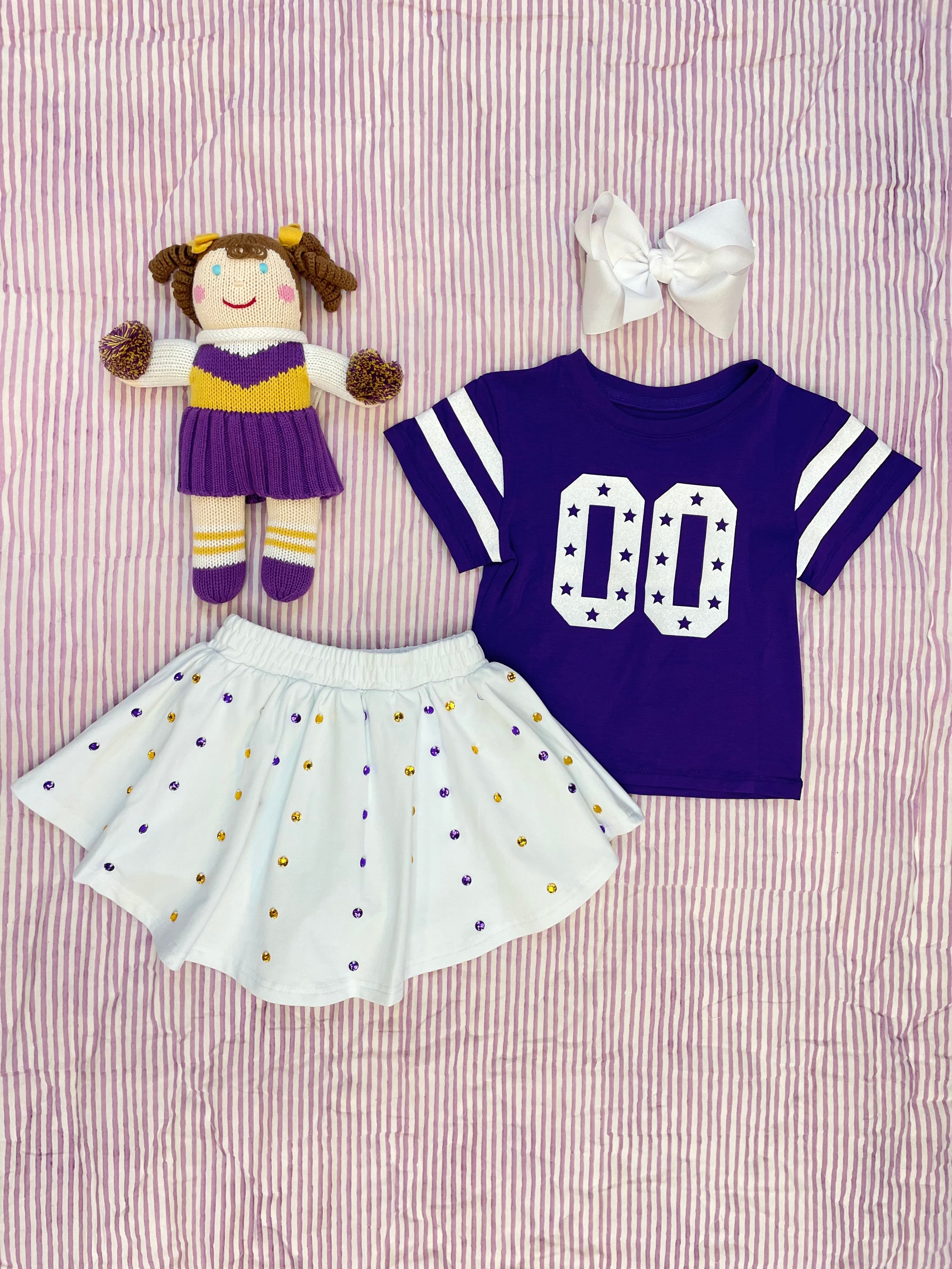 Show your team spirit in style with the Azarhia Glitter Double 00 Stars Boxy Purple Gameday Tee. This playful purple tee features a sparkling double 00 glitter design on the chest, adding a fun and eye-catching touch to your game day outfit. Its boxy fit keeps you comfortable and cool while cheering on your favorite team. Perfect for fans who want to shine bright in the stands!
95% cotton 5% spandex
Machine wash with like colors, Do not bleach, Tumble dry low.