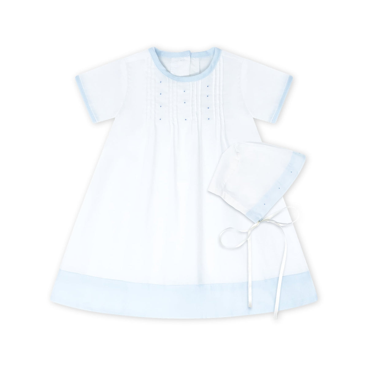 This 1956 Daygown set in white and blue scallop batiste with blue embroidery knots and bonnet is perfect for her most special first occasions and can be passed down with love to future generations.