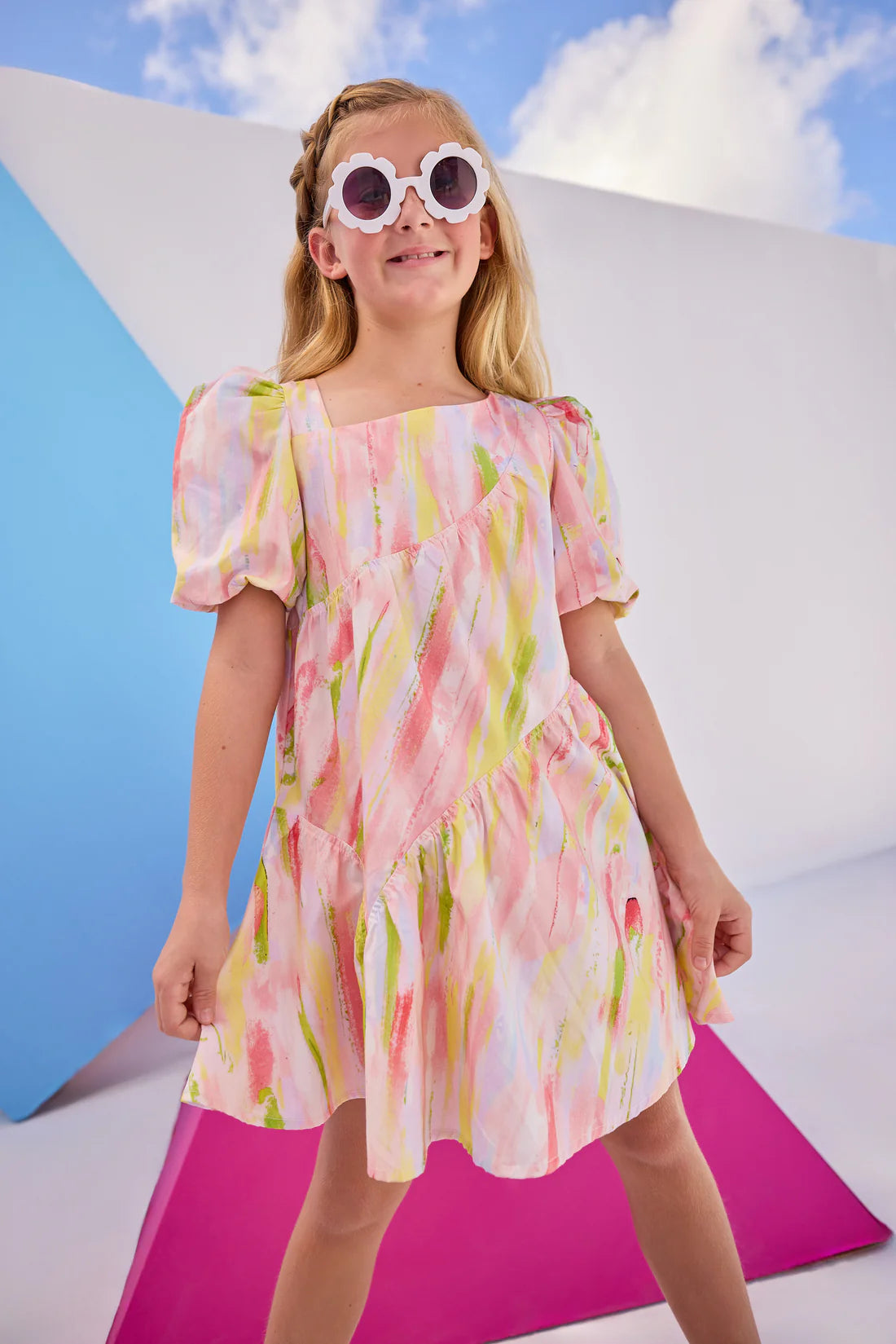 Our eye-catching Asymmetrical Dress is sure to turn heads this Spring and Summer! Featuring a fun asymmetrical neckline, your BISBY girl will reach for this dress every time! The elastic cuff sleeves and asymmetrical neckline is an elevated look you can only find here at BISBY!