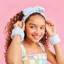 Pamper yourself in style with our Sprinkle Spa Day Headband and Cuff Set by Iscream. Made with soft chenille material, this set includes 1 headband and 2 cuffs, providing ultimate comfort during your spa day. Measuring 7" w x 7 1/4" h, it&