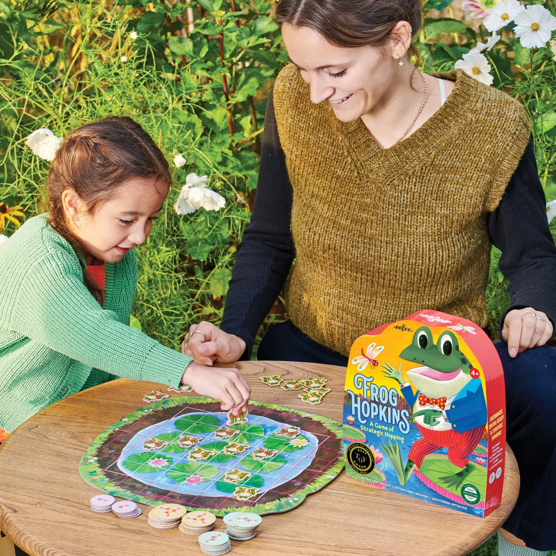 A simple, satisfying game of spatial intelligence and strategic blocking. Players take turns placing and hopping their own frogs to earn dragonflies. Easy instructions and scalable rules engage the whole family for any level of play.