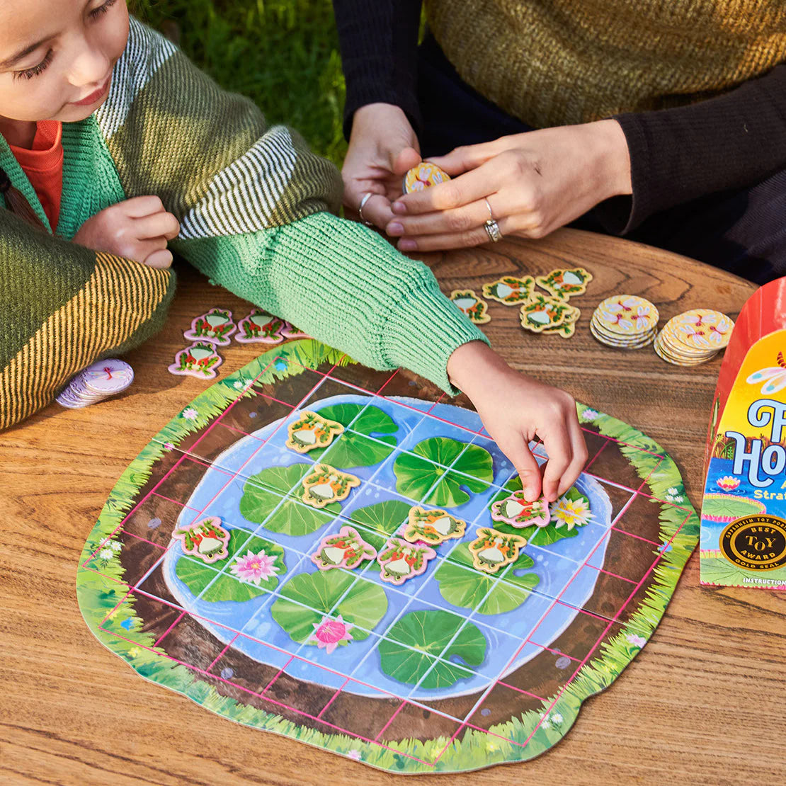 A simple, satisfying game of spatial intelligence and strategic blocking. Players take turns placing and hopping their own frogs to earn dragonflies. Easy instructions and scalable rules engage the whole family for any level of play.
