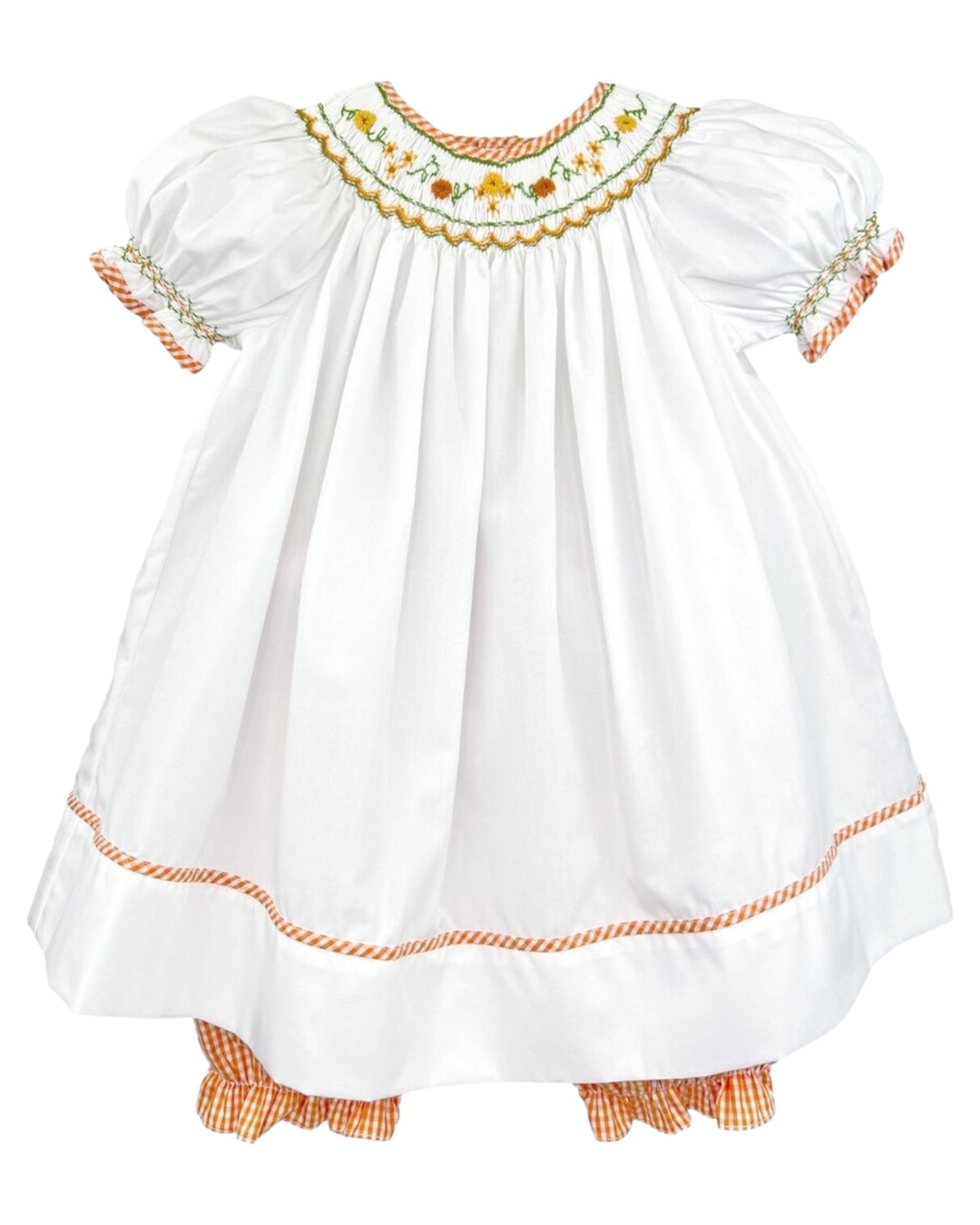 A sweet and stylish dress that is perfect for everything fall, from Halloween to Thanksgiving to any special occasion!

Our harvest bishop smocked dress comes in a soft white fabric with floral smocking in   an orange fall color scheme. Matching orange check pantaloons complete this look. This short sleeve dress is made with a cotton-poly blend fabric that is lightweight, airy and machine washable for easy care!