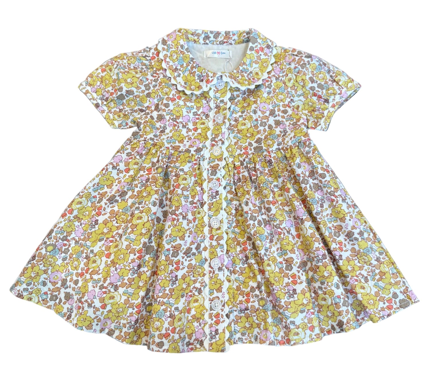 The Maggie Dress is all about timeless charm with a playful twist. Featuring a button-front design, soft floral print, and scalloped trim, it’s that picture-perfect piece made for every sweet moment this season.