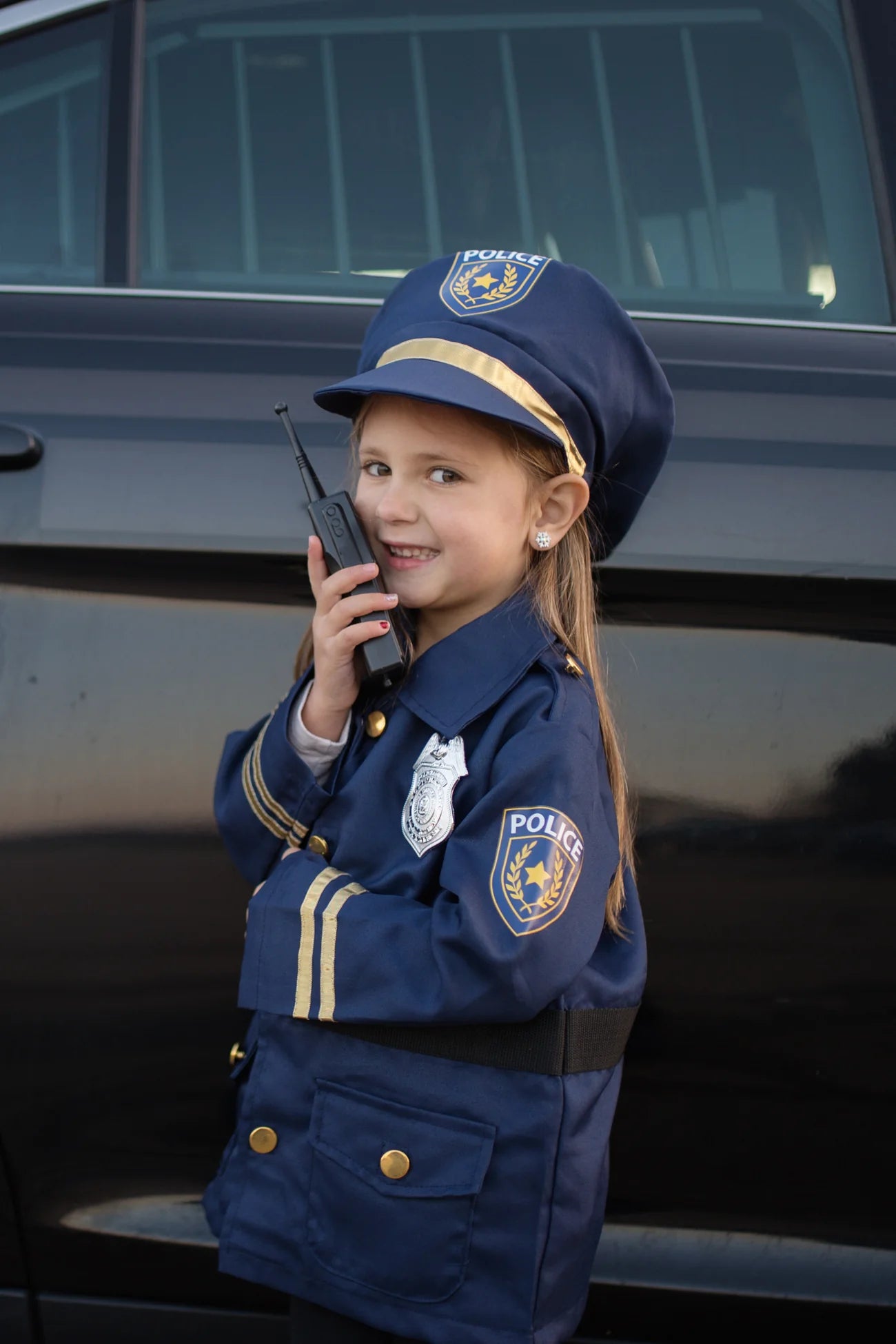 Police officer set includes: Jacket, Hat, Handcuffs, Walkie Talkie, Badge, and Name Badge.