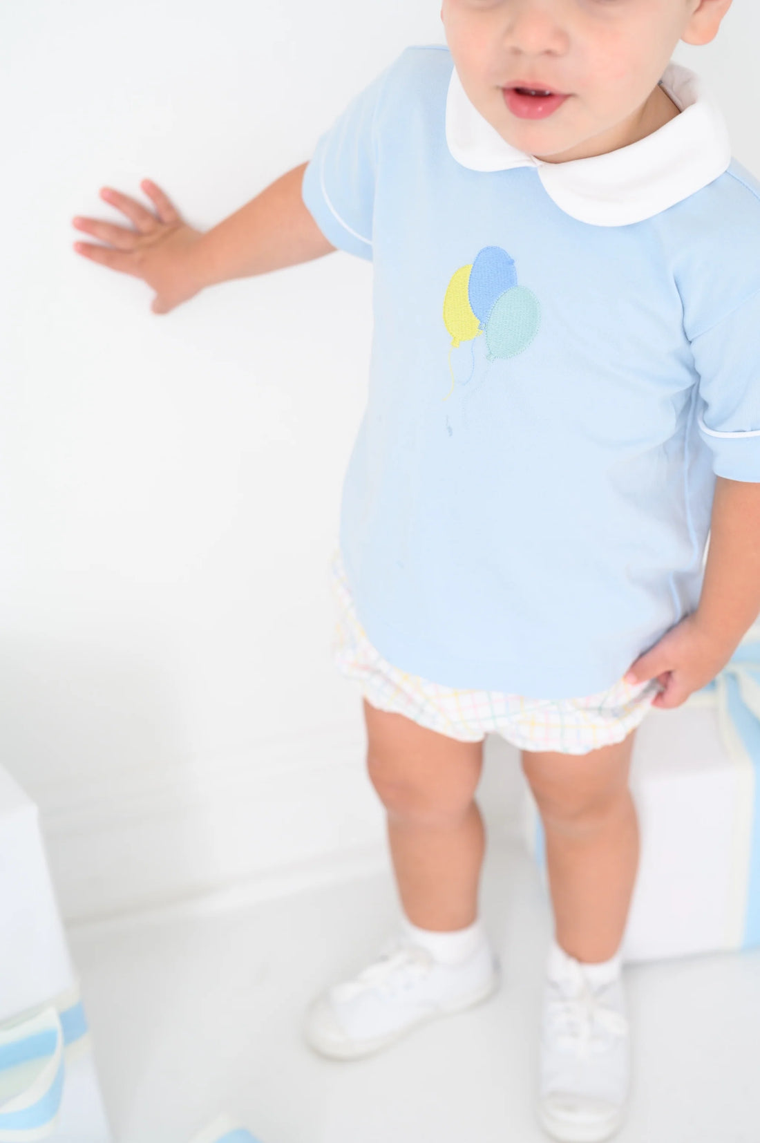 Bluffton blue knit top with white piping and balloon embroidery on the chest with custom party time plaid woven bloomers.