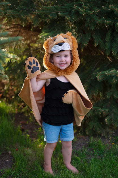 Get ready to rule the jungle in our Woodland Storybook Lion Cape. Little lions will love this soft and cuddly cape complete with lion hood and built-in-paws.