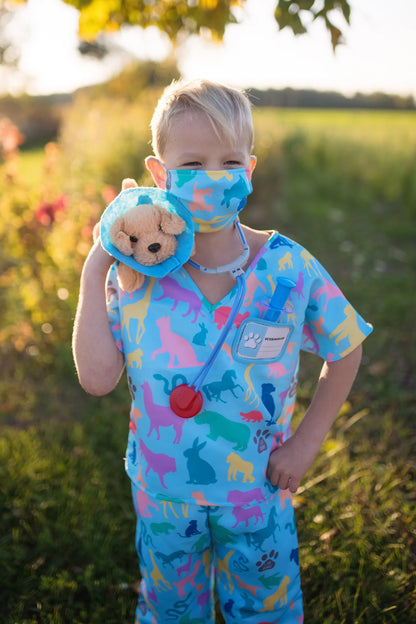 The vet is in! The adorable Veterinarian Set includes Scrubs: Shirt and Pants, Mask, Plush Puppy with removable Cone, Syringe with working plunger, Stethoscope, and a Name Card. Fully accessorized to play animal doctor your child will love taking care of plush animals! Taking care of your stuffed animals is the perfect way to nurture and develop compassion in young children, and it’s a fun and engaging way when suited up with these colourful animal print scrubs and realistic-looking accessories. 
