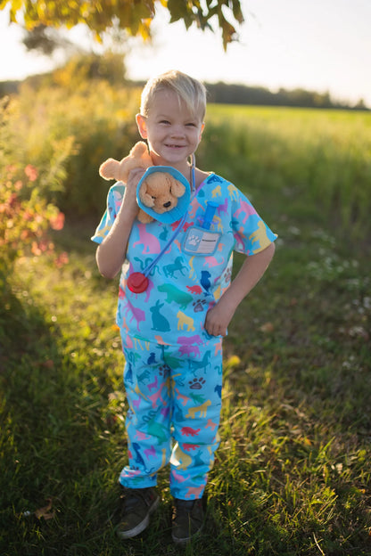 The vet is in! The adorable Veterinarian Set includes Scrubs: Shirt and Pants, Mask, Plush Puppy with removable Cone, Syringe with working plunger, Stethoscope, and a Name Card. Fully accessorized to play animal doctor your child will love taking care of plush animals! Taking care of your stuffed animals is the perfect way to nurture and develop compassion in young children, and it’s a fun and engaging way when suited up with these colourful animal print scrubs and realistic-looking accessories. 